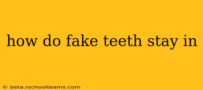 how do fake teeth stay in