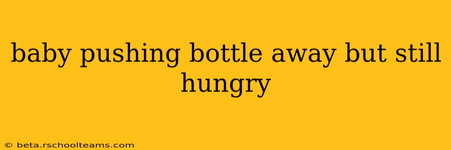 baby pushing bottle away but still hungry