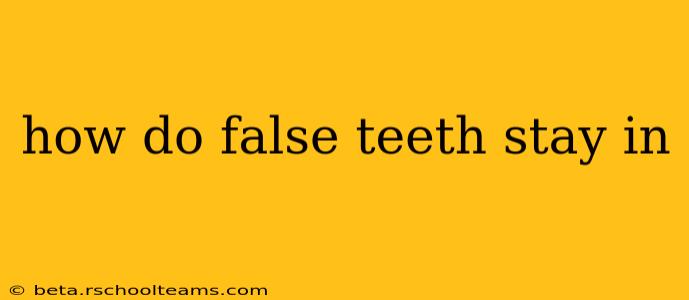 how do false teeth stay in